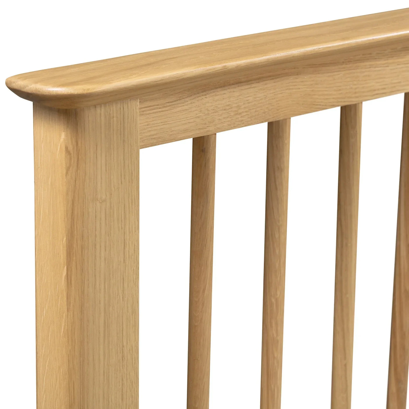 Cotswold oak double bed frame closeup showing light wood slatted headboard design