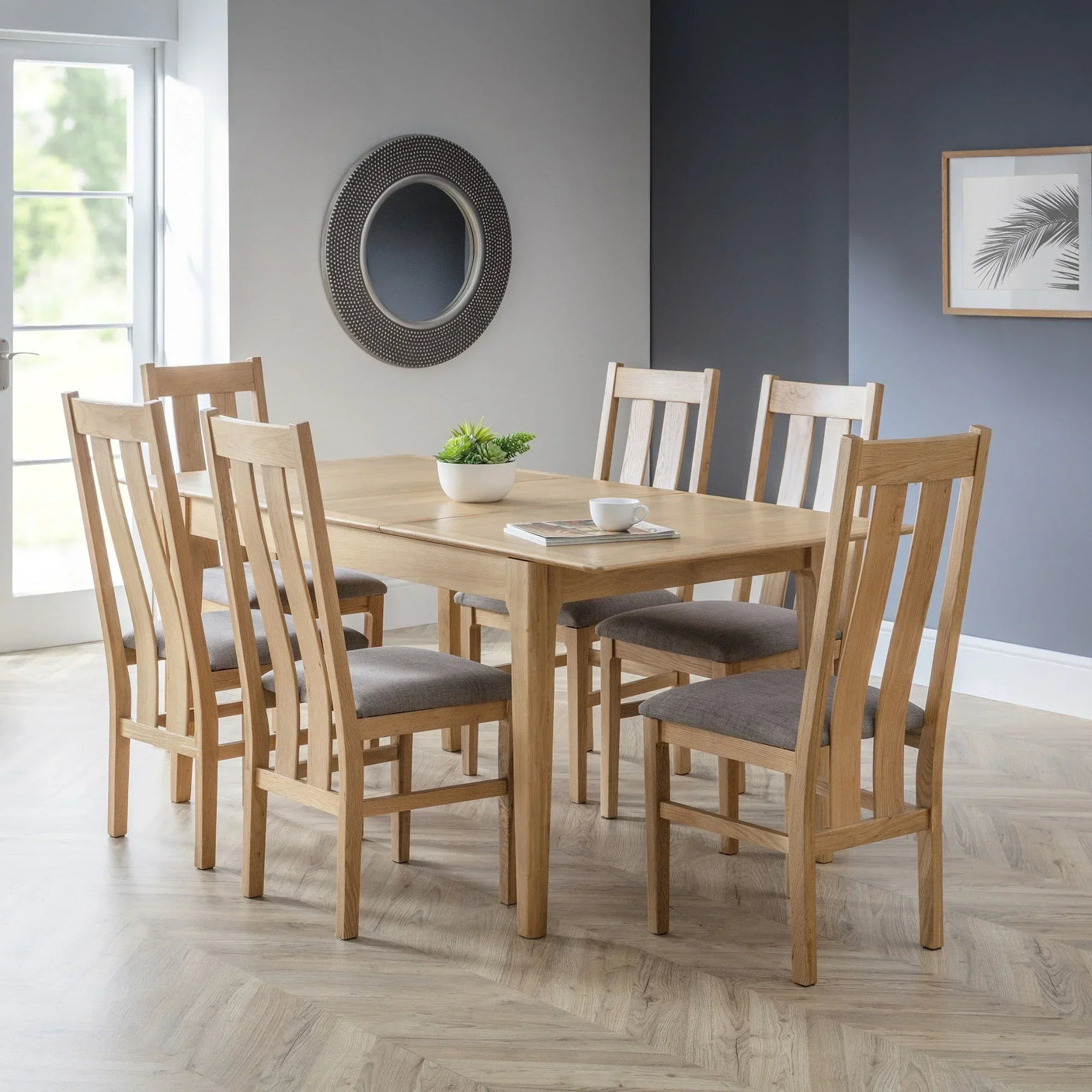 Cotswold dining chairs with padded seats around oak table in a modern dining room