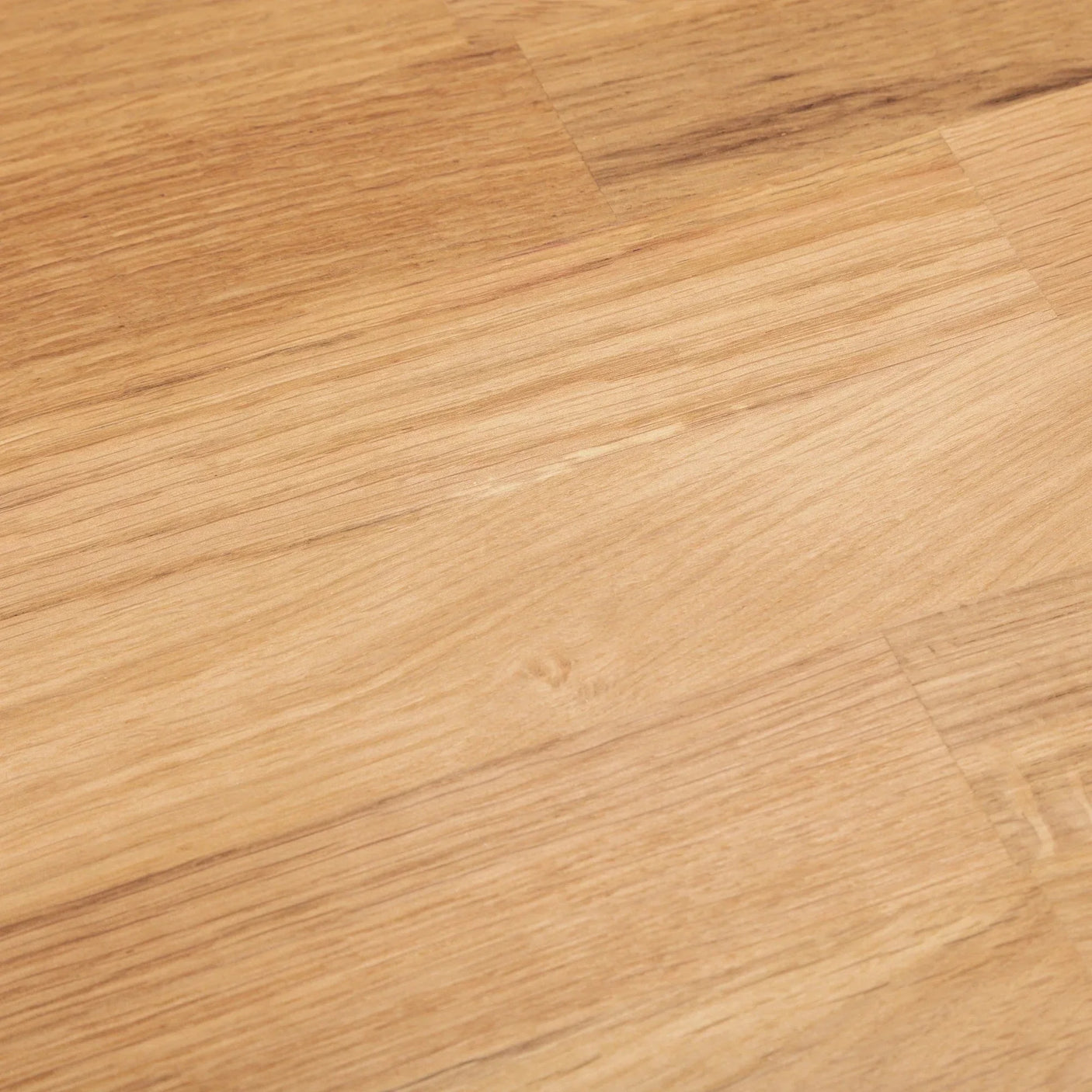 Close-up of rectangular oak dining table surface with natural wood grain detail