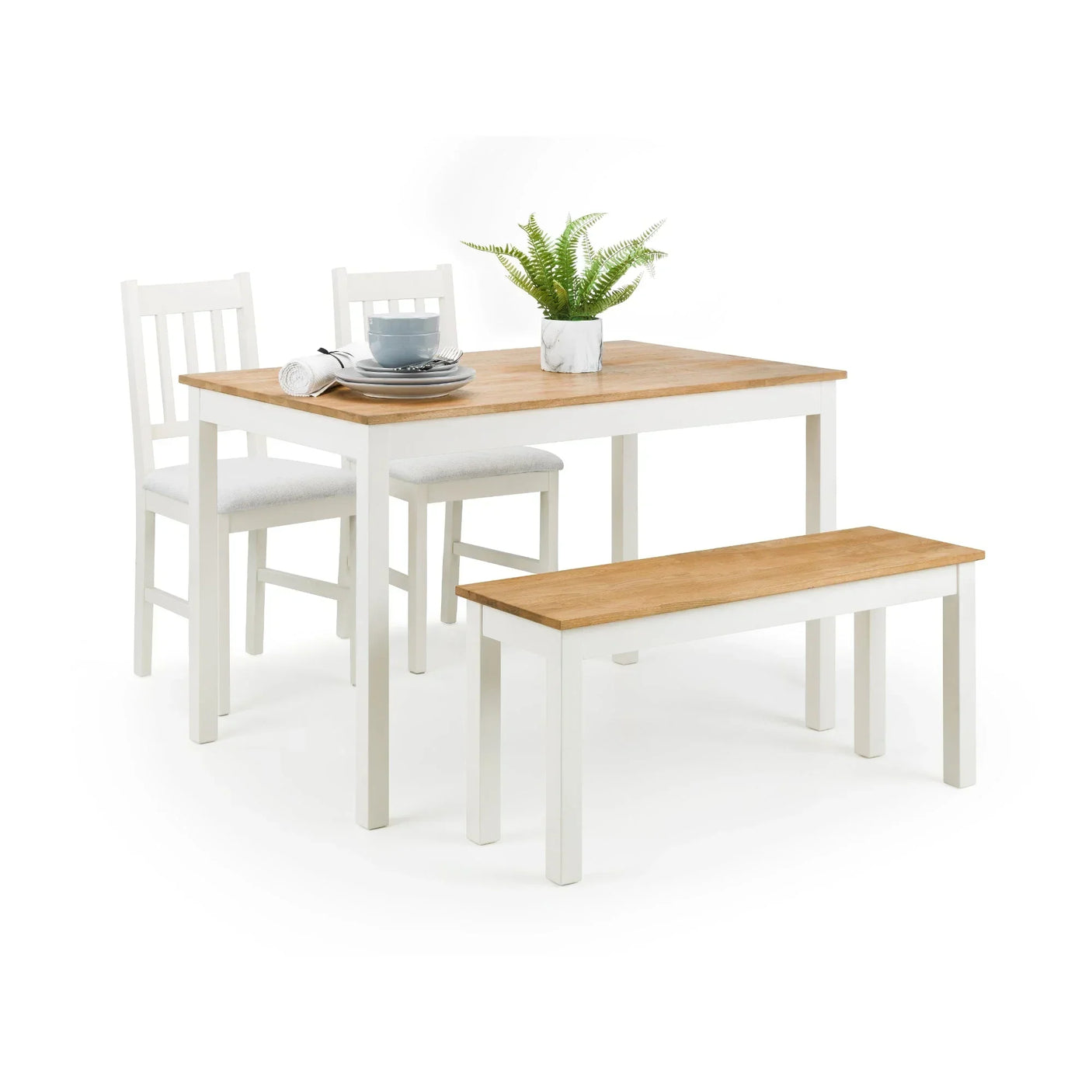 Ivory oak rectangular dining table set with two chairs, bench, and tableware on top
