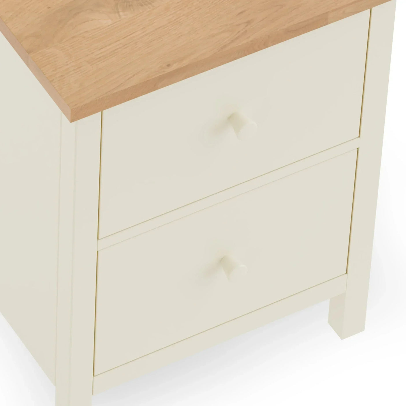 Cream bedside table with two drawers and oak effect top, angled side view
