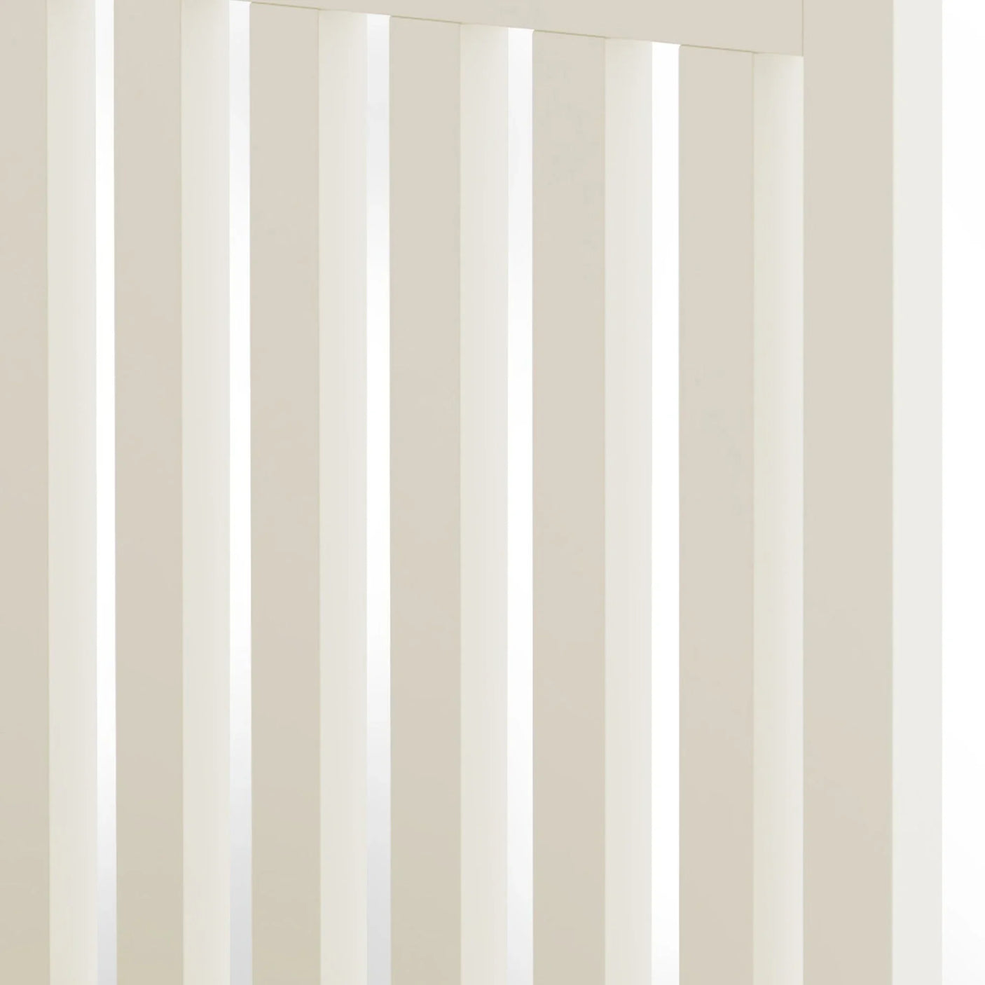 Closeup of cream wooden bed frame with vertical slats, showing smooth painted finish