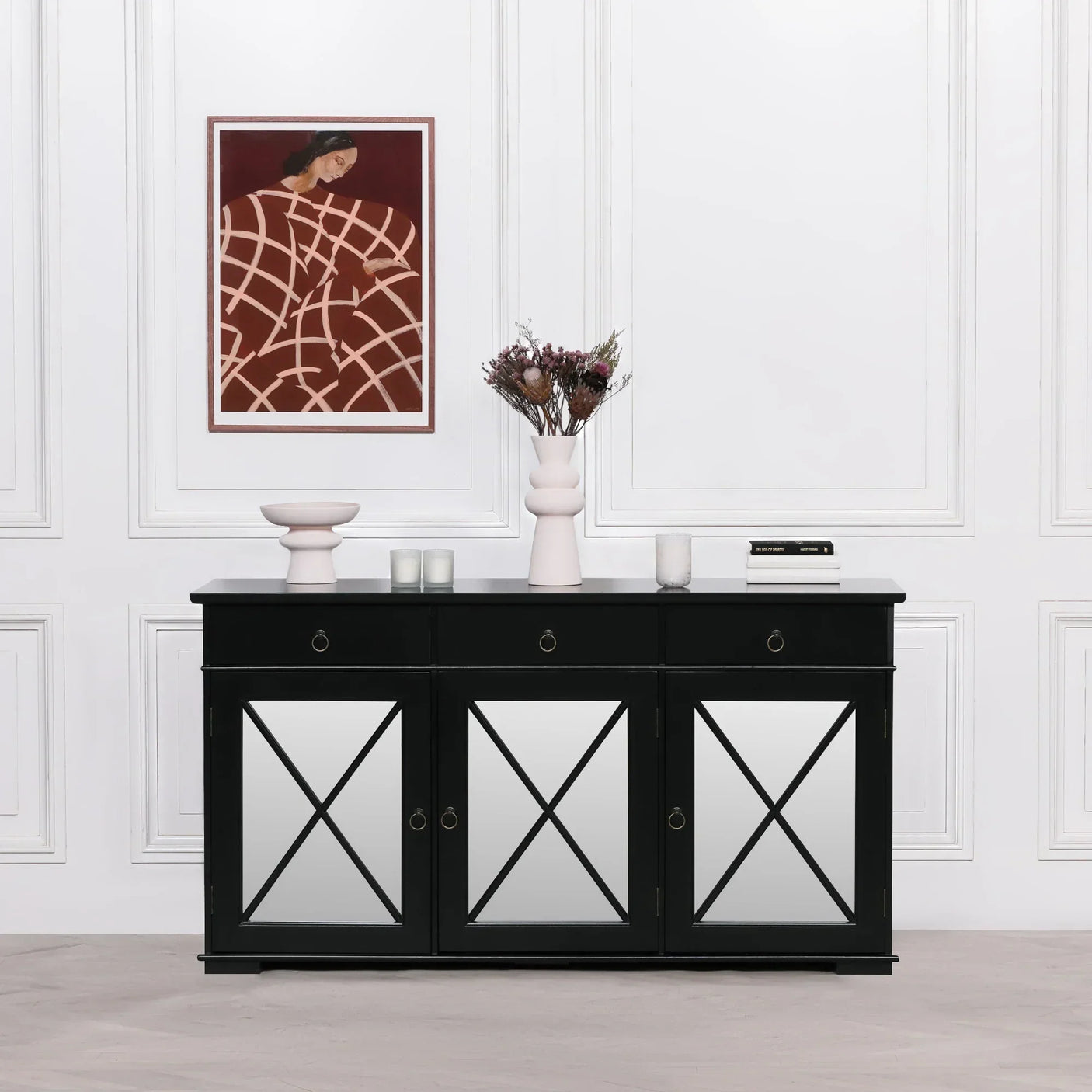 Black mirrored sideboard with three drawers and geometric doors in modern living room