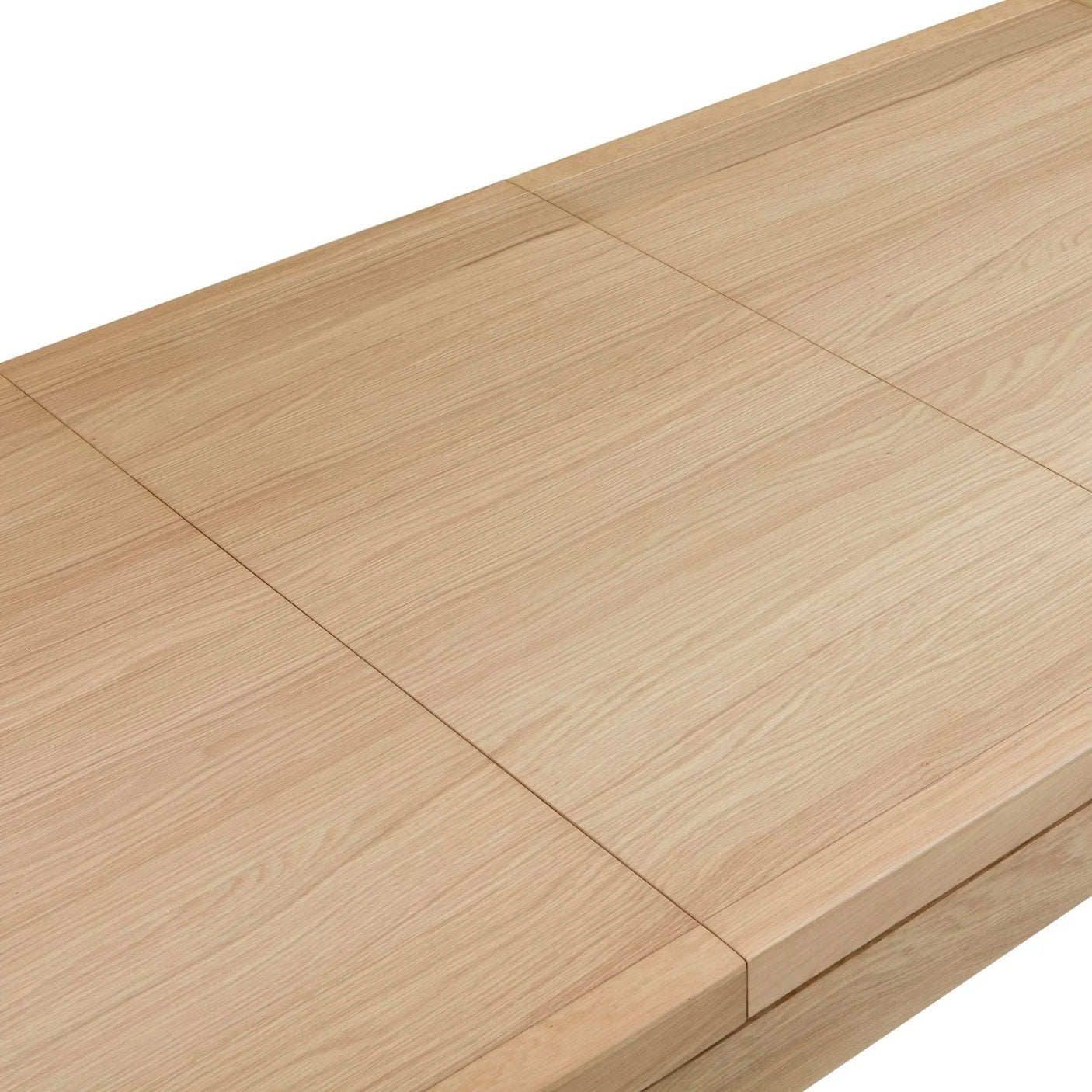 Close up of oak dining table with visible grain and extendable leaf join