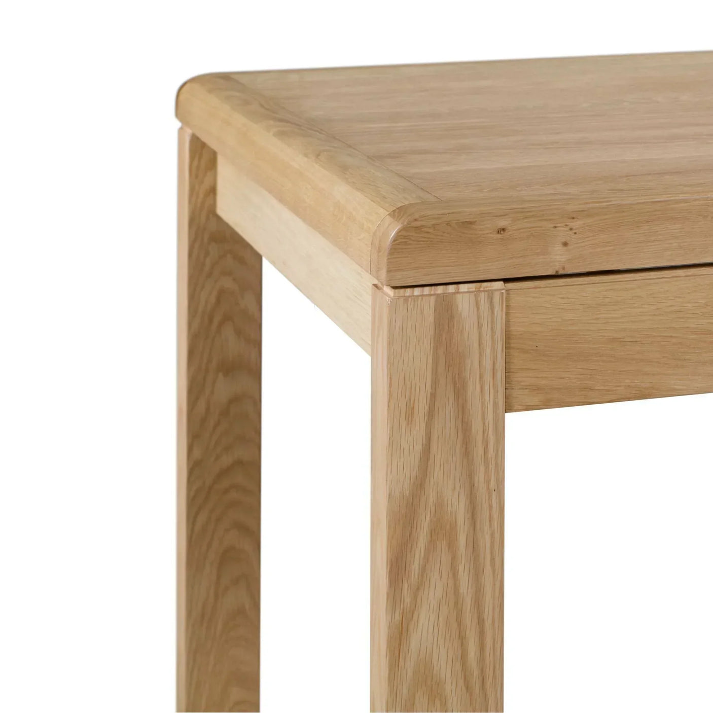 Corner detail of oak dining table showing smooth finish and sturdy wooden leg