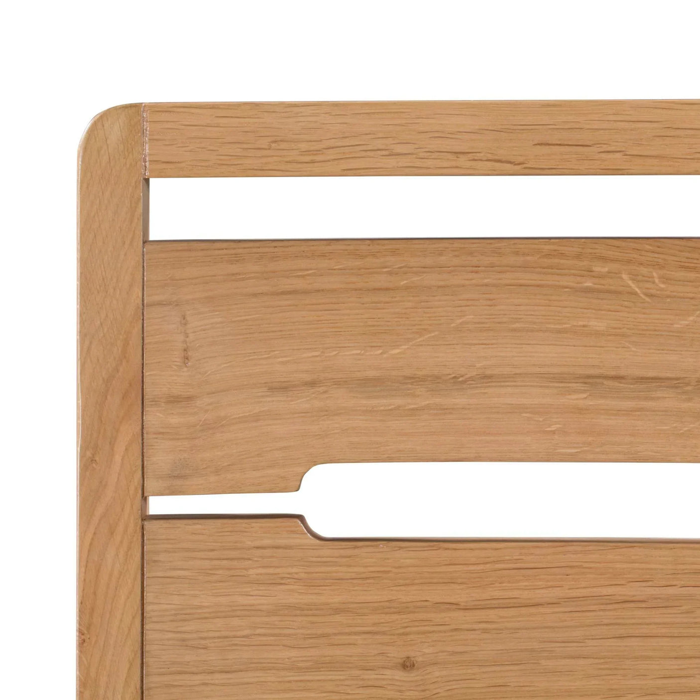 Close view of Curve Oak dining chair backrest with natural wood grain and cut-out detail