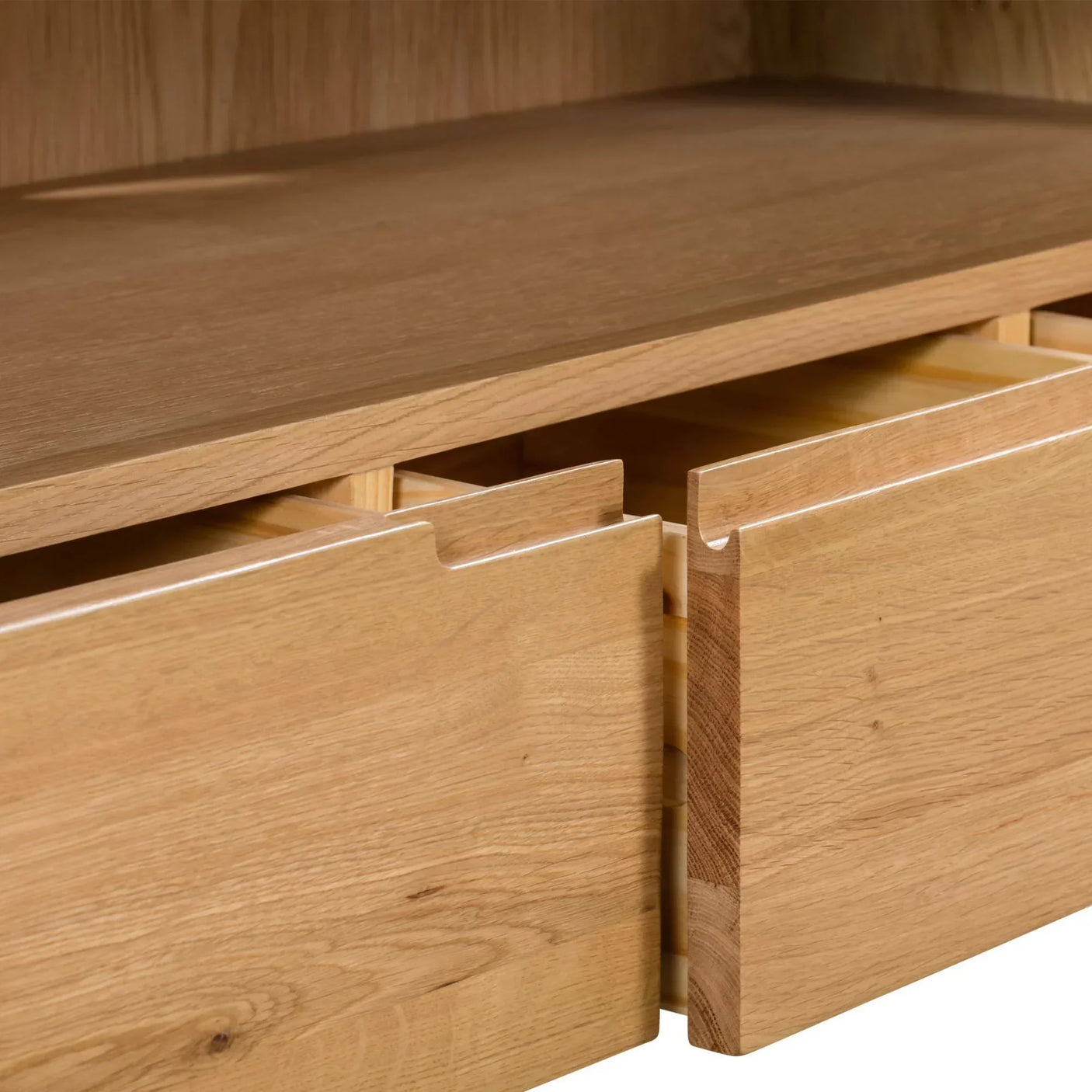 Oak TV unit closeup showing open drawers and smooth wood grain detail