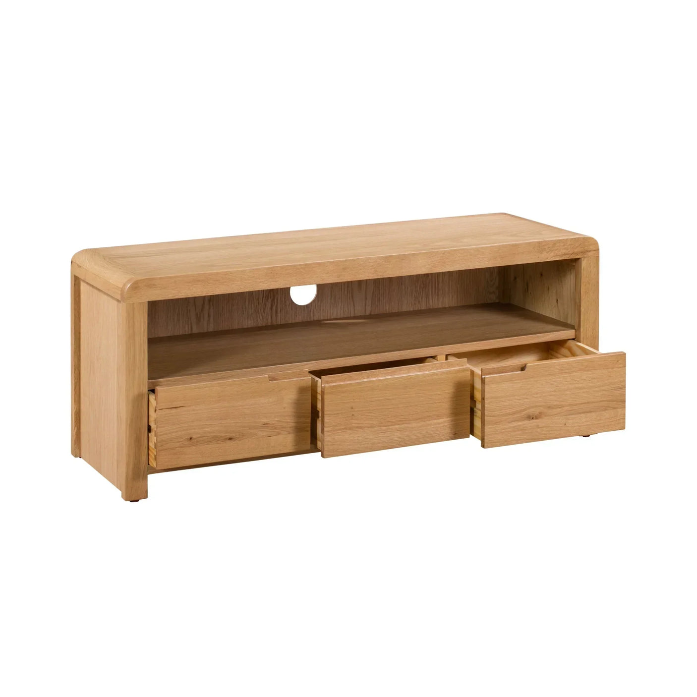 Oak TV unit with open shelf, cable hole, and three lower drawers on white background