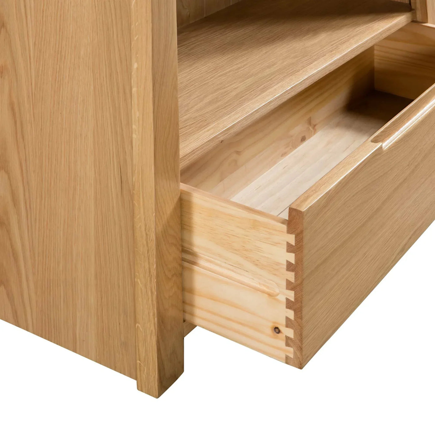 Oak TV unit with open dovetail joint drawer and visible wood grain detail