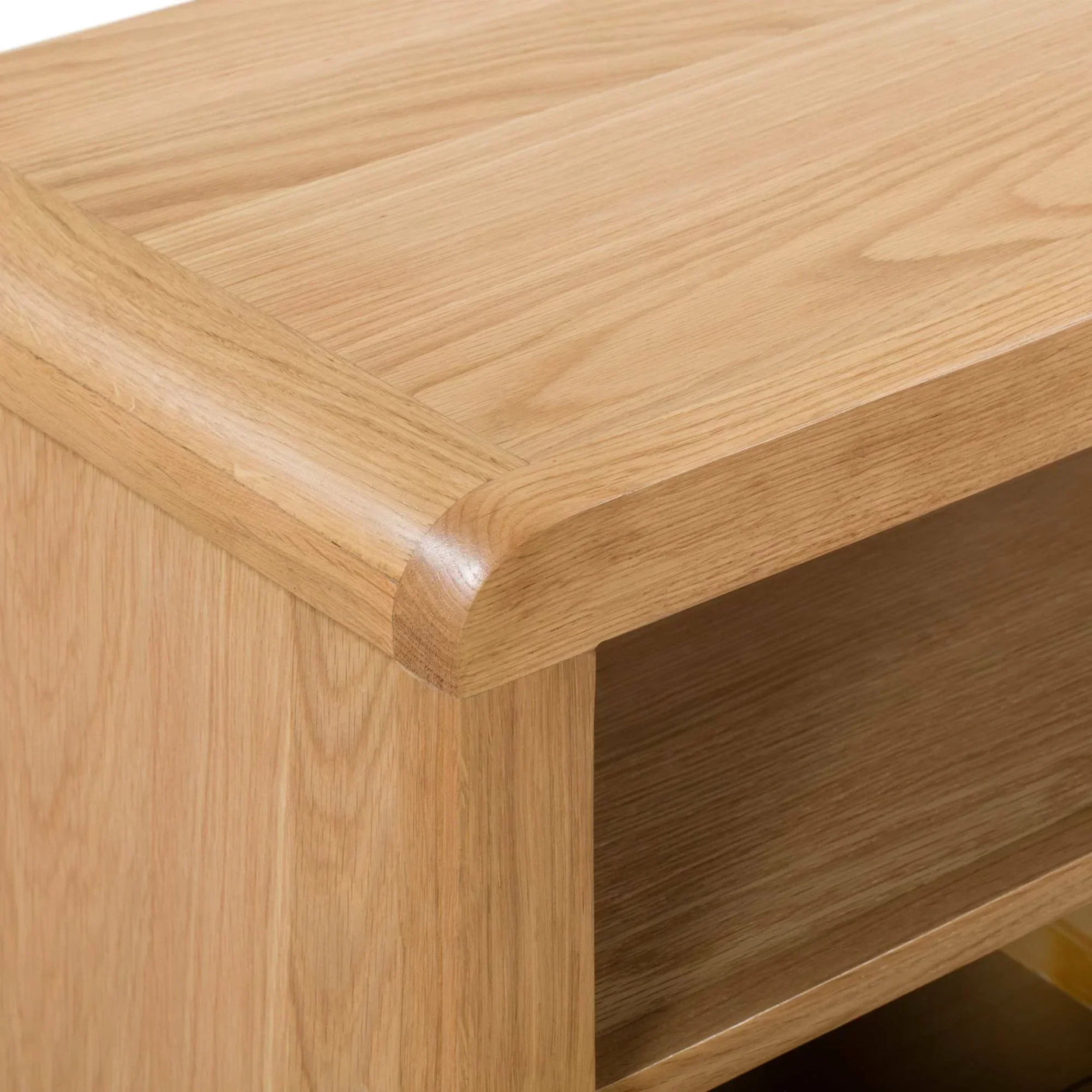 Oak TV unit close-up showing curved edge and visible wood grain