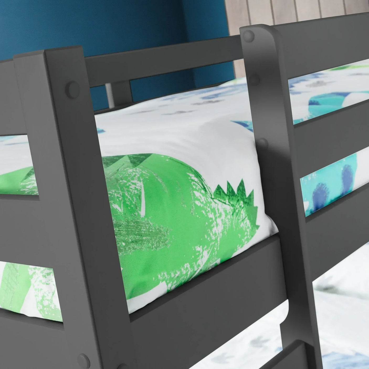 Anthracite bunk bed frame close-up with green and white patterned bedding
