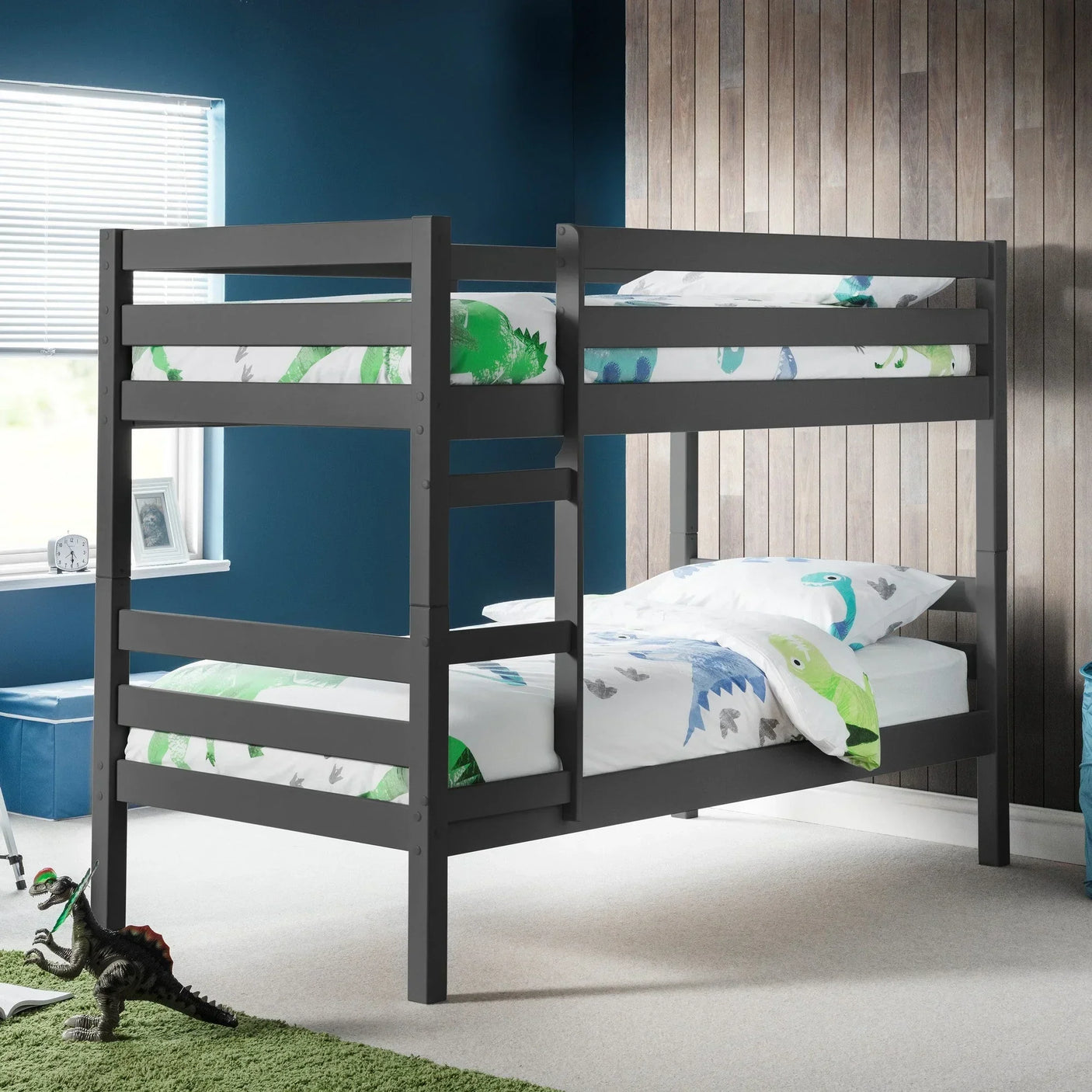 Anthracite bunk bed with ladder in kids room, dinosaur bedding, blue and wood panel walls