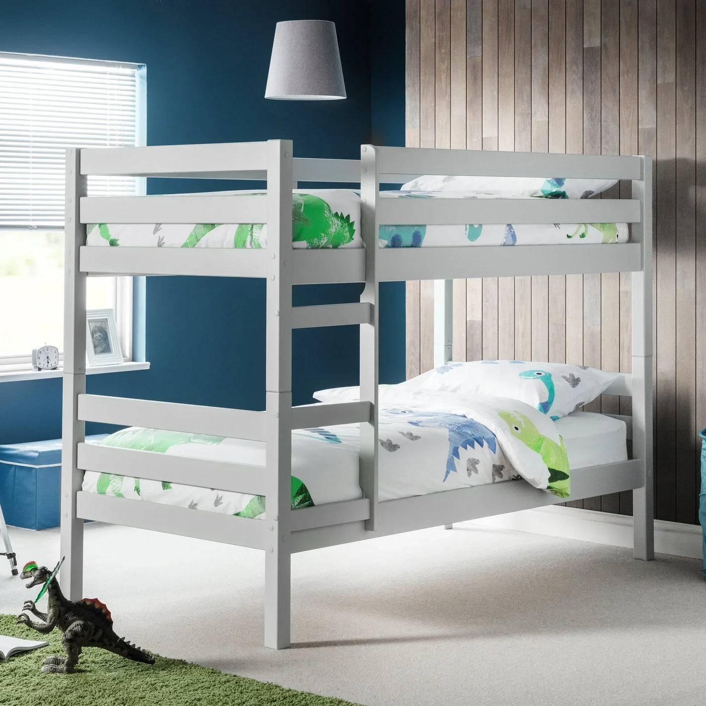 Grey wooden bunk bed with dinosaur bedding in a modern kids bedroom