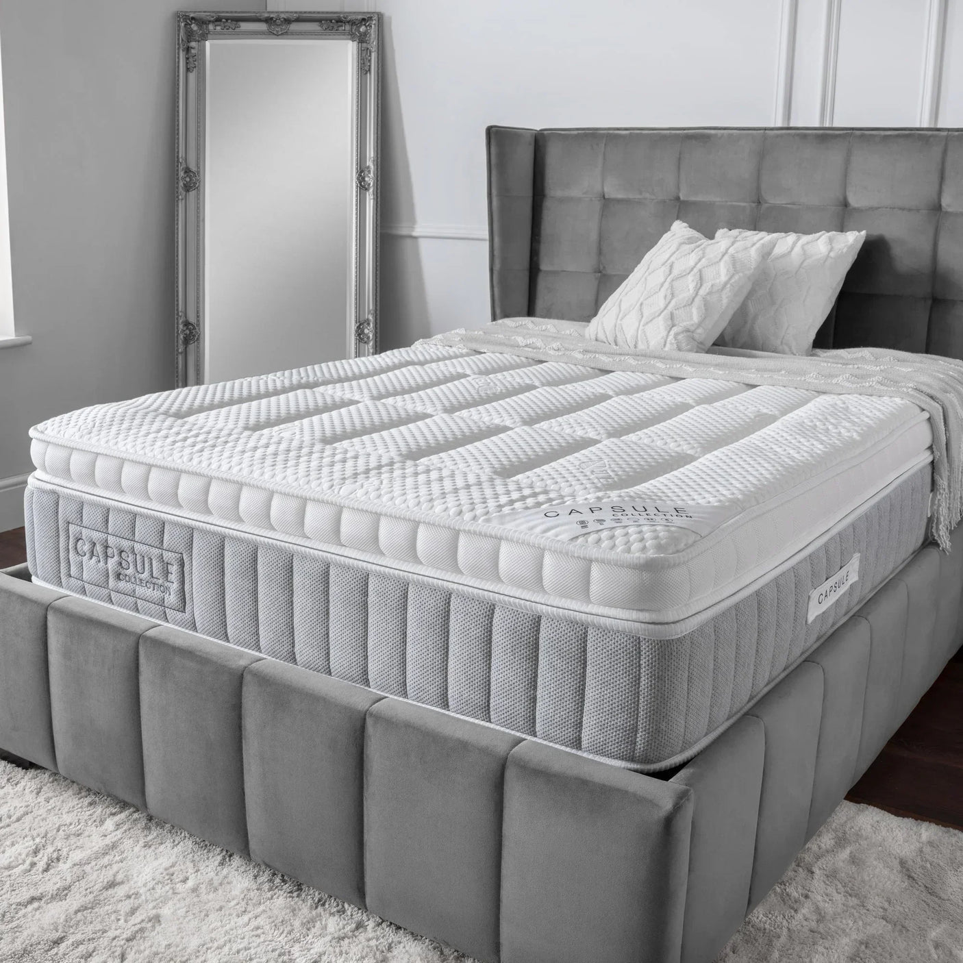Pocket sprung mattress with quilted top on grey upholstered bed in modern bedroom