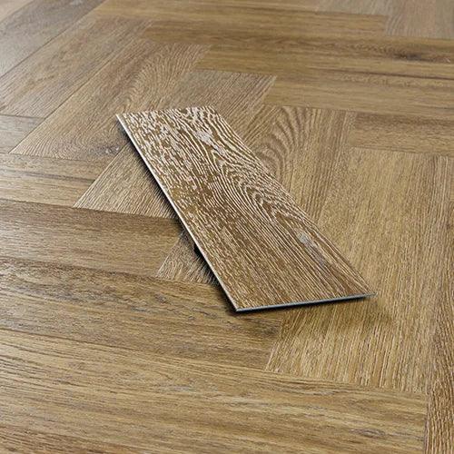 Chestnut wood effect vinyl flooring sample on herringbone pattern floor