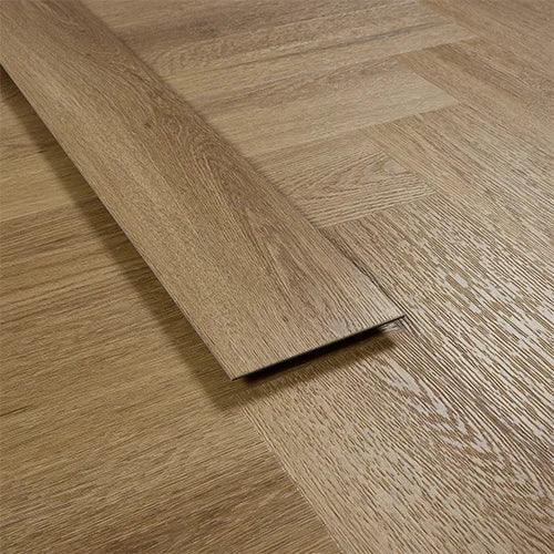 Chestnut vinyl flooring plank on wood textured floor, close-up view of pattern and finish