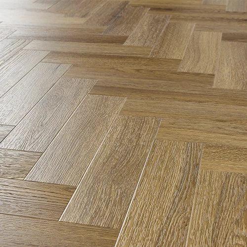 Chestnut wood effect flooring in herringbone pattern with natural grain texture