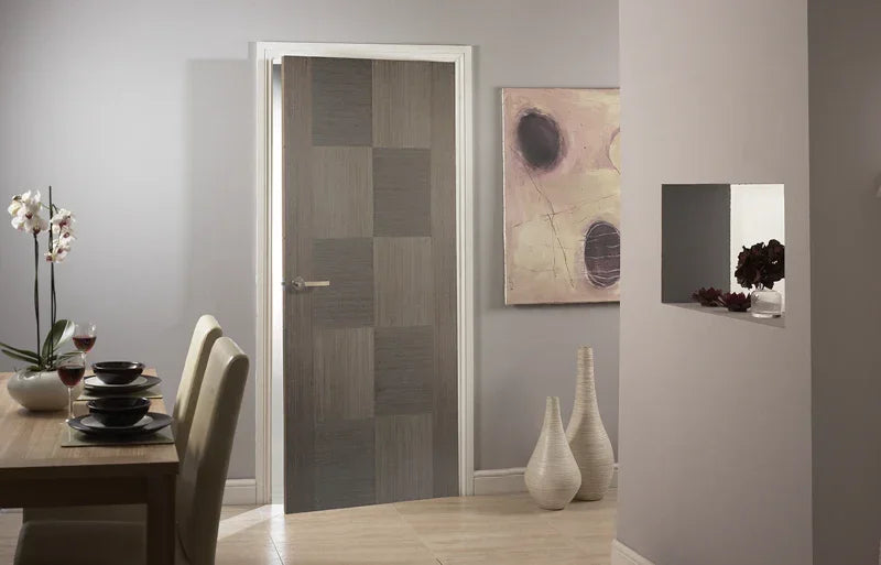 Chocolate grey interior door with modern panel design in contemporary dining room