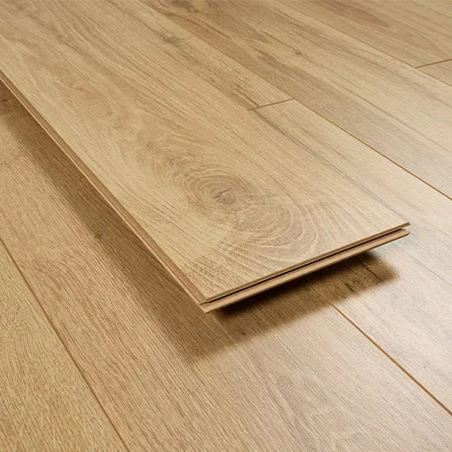 Classic oak laminate flooring plank on wood floor, showing grain and color details