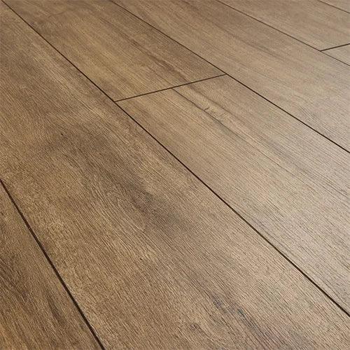 Cognac oak laminate flooring planks with natural wood grain texture and warm brown tone