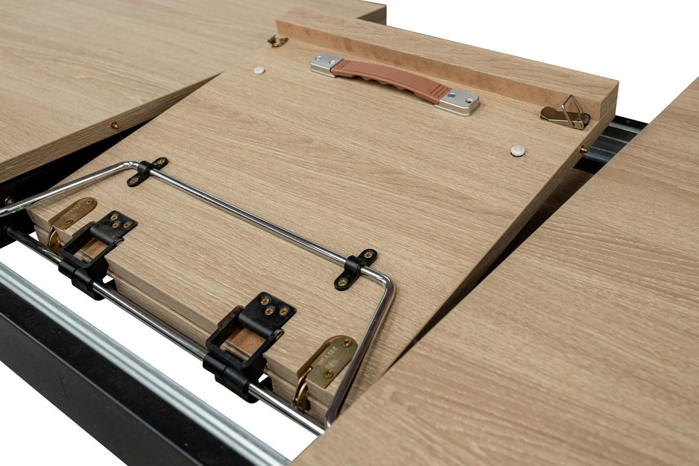 Oak extendable dining table close-up showing mechanism and extension leaf with metal fittings