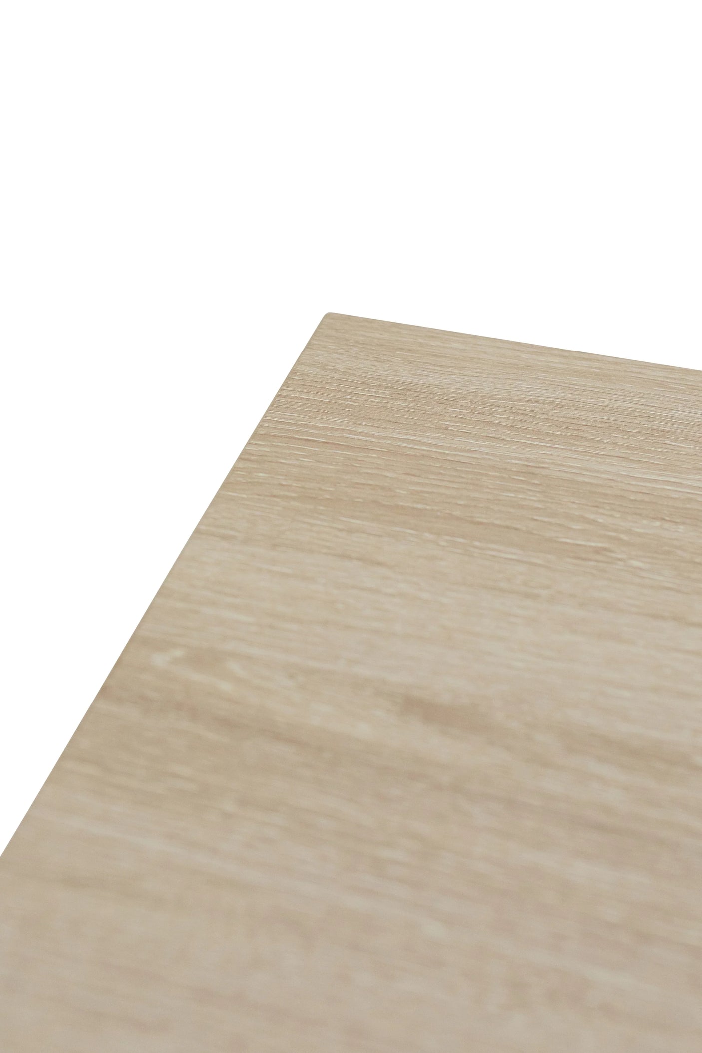 Close up of light oak wood effect table corner with textured grain finish