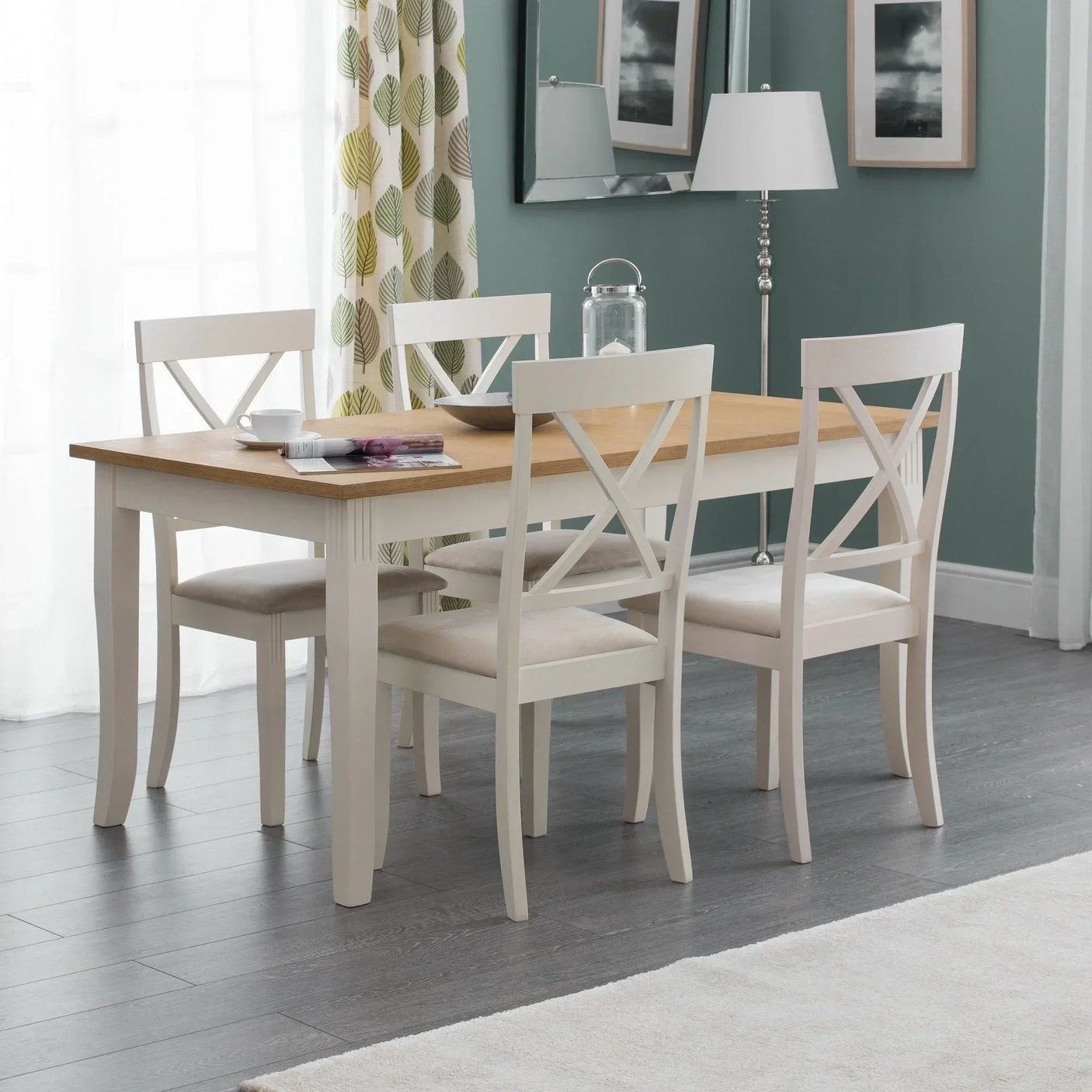 Oak and white dining table set with four chairs in a modern dining room