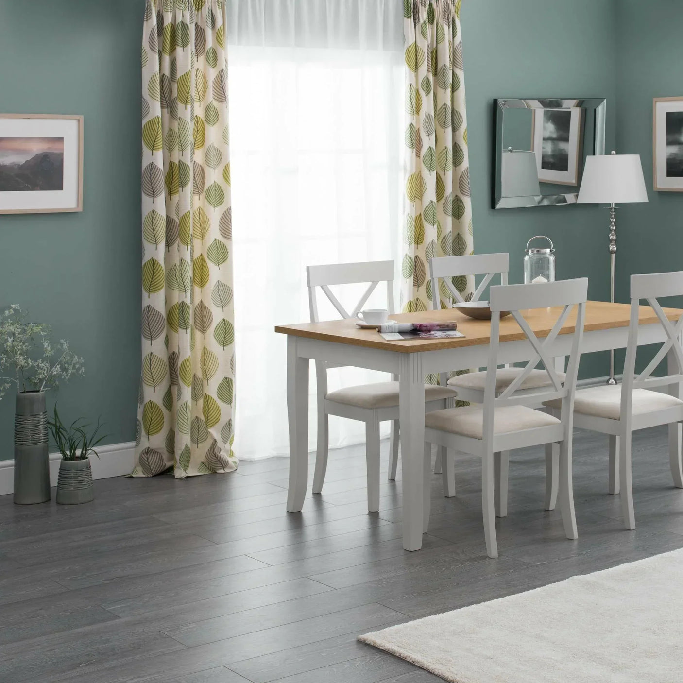 Oak and grey dining table with four chairs in modern dining room with leaf curtains