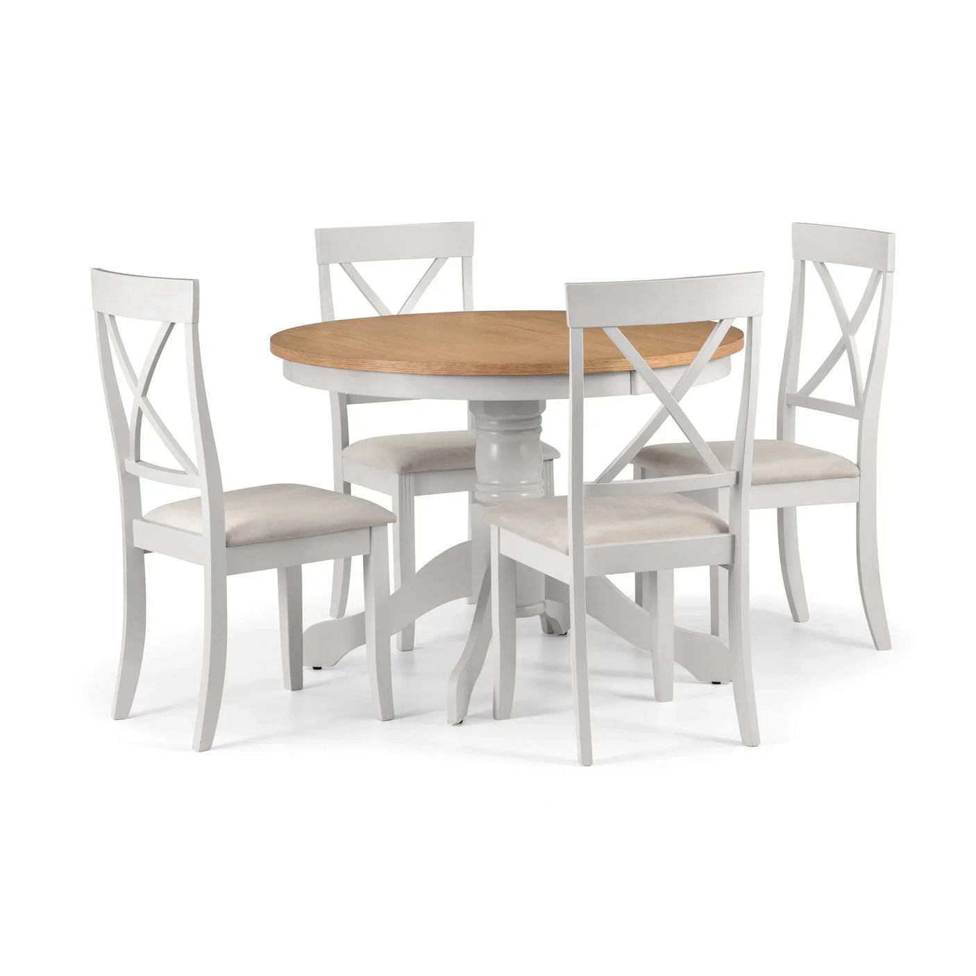 Round wooden dining table with four white cross-back chairs and cushioned seats