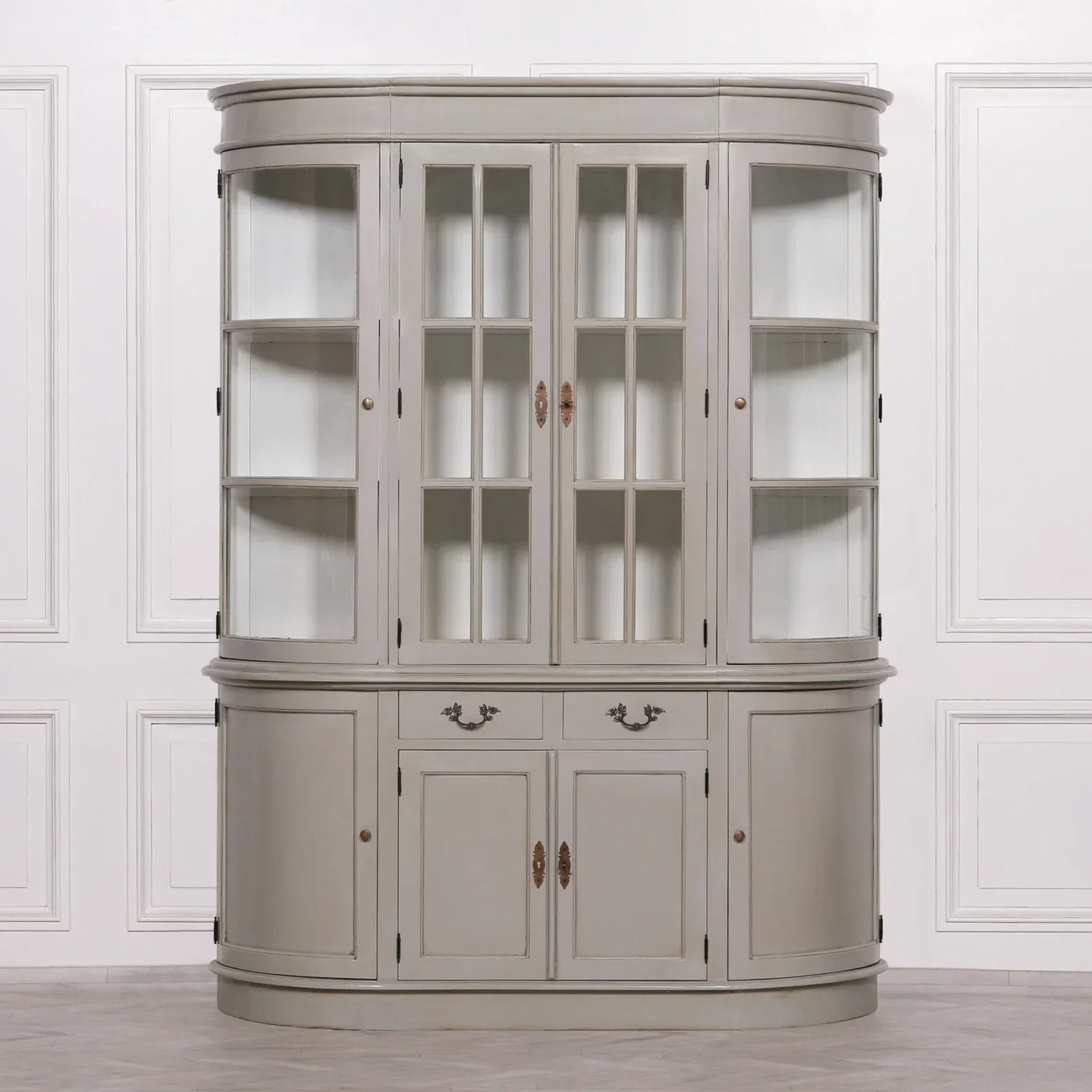 Grey wooden display cabinet with glass doors, side shelves, and lower storage drawers