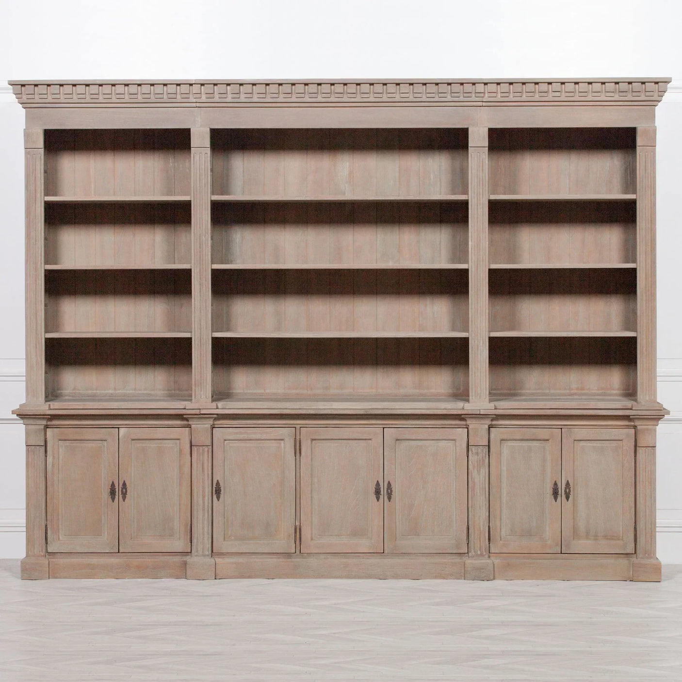 Large wooden bookcase with open shelves and lower storage cabinets, front view
