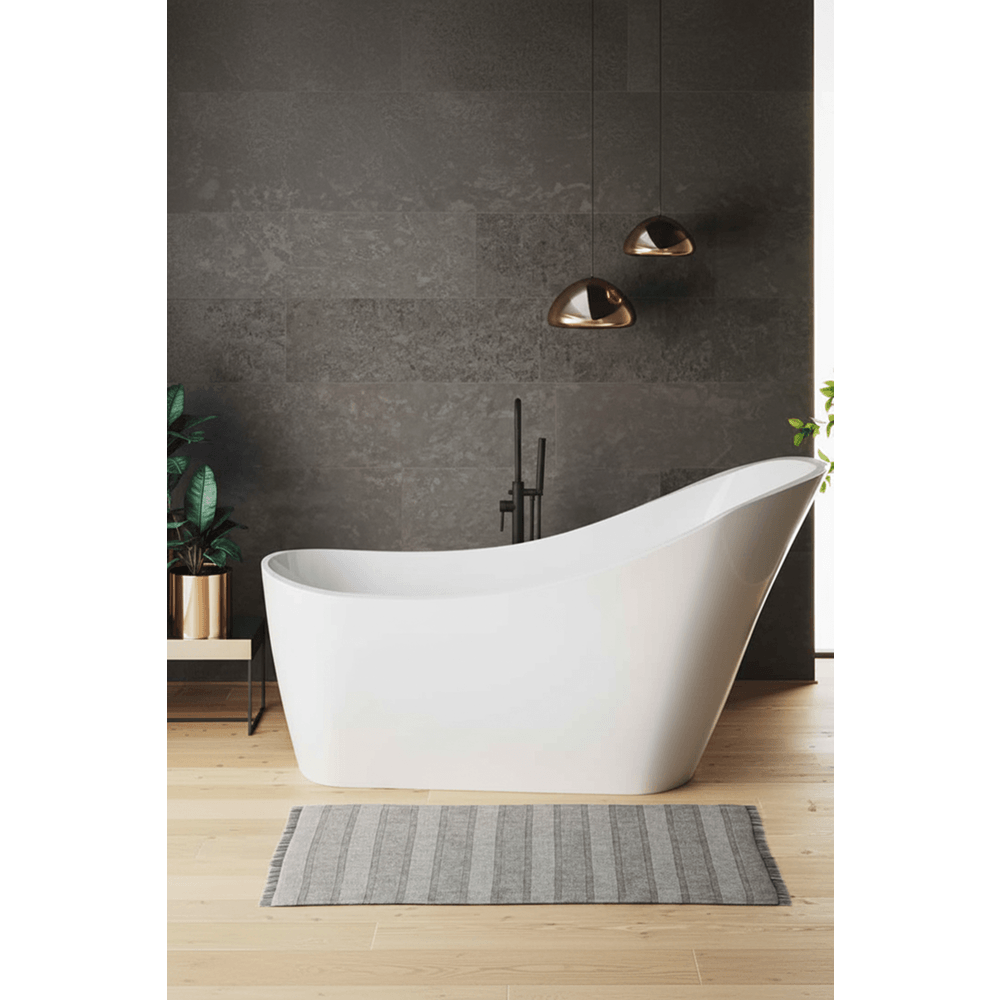 Modern bathroom with a freestanding white bathtub against a dark gray wall.