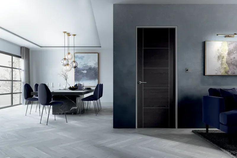 Dark grey laminate door in modern dining room with navy chairs and marble table