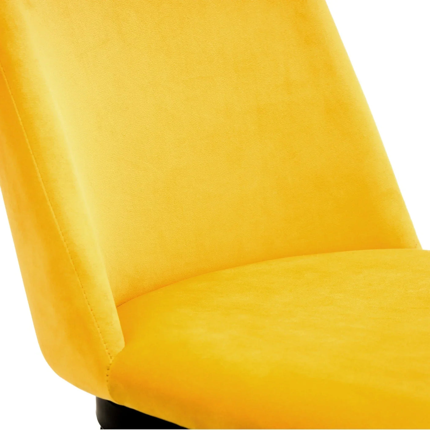 Mustard accent chair close-up showing soft velvet fabric and angled backrest
