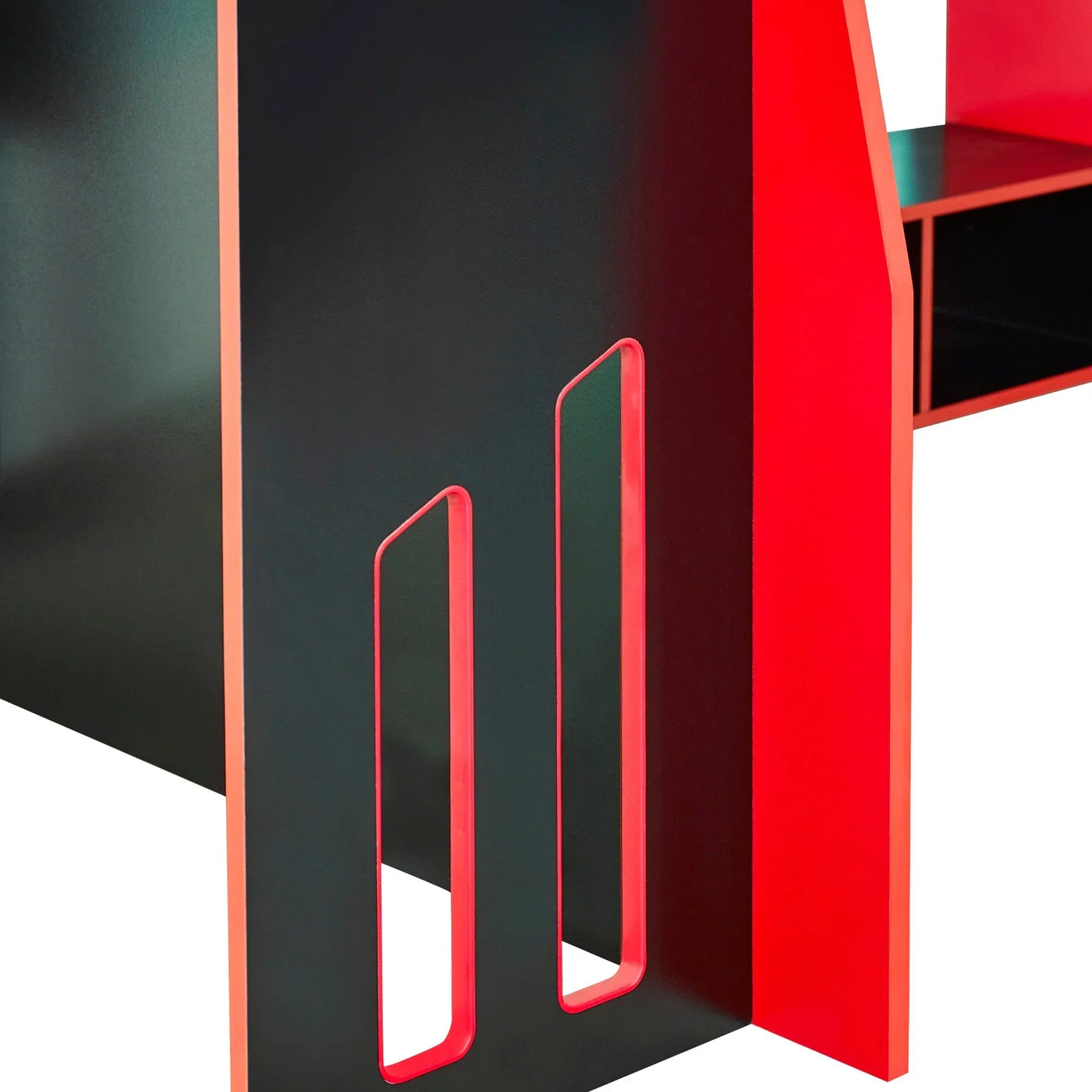 Closeup of black and red desk leg with cut-out details and shelving unit