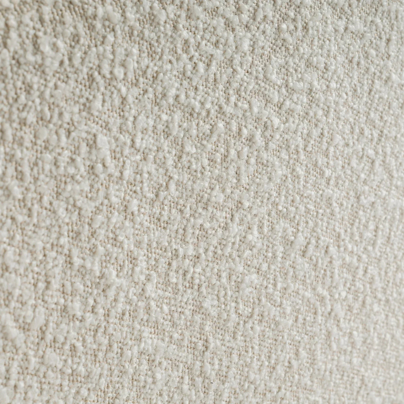 Ivory boucle fabric texture close-up on double bed upholstery
