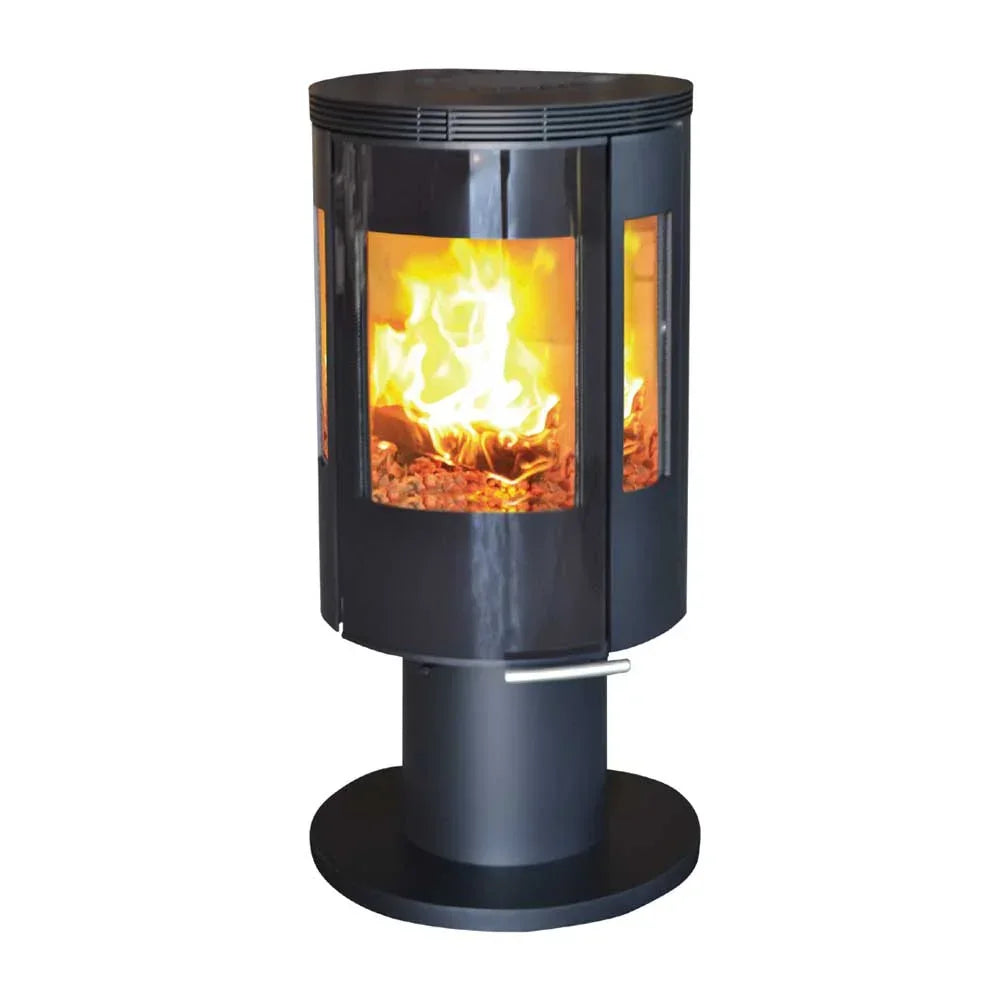 Black pedestal wood burning stove with glass panels and visible flames inside