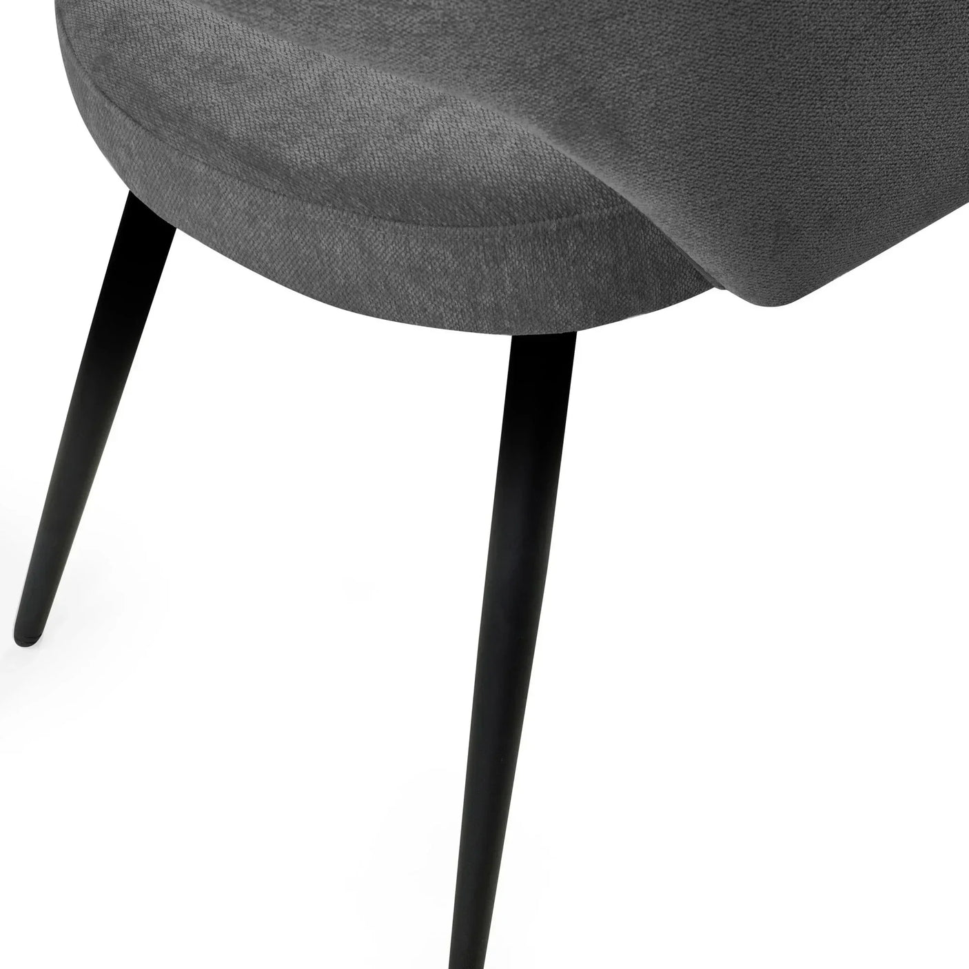 Grey fabric dining chair seat with tapered black metal legs close-up