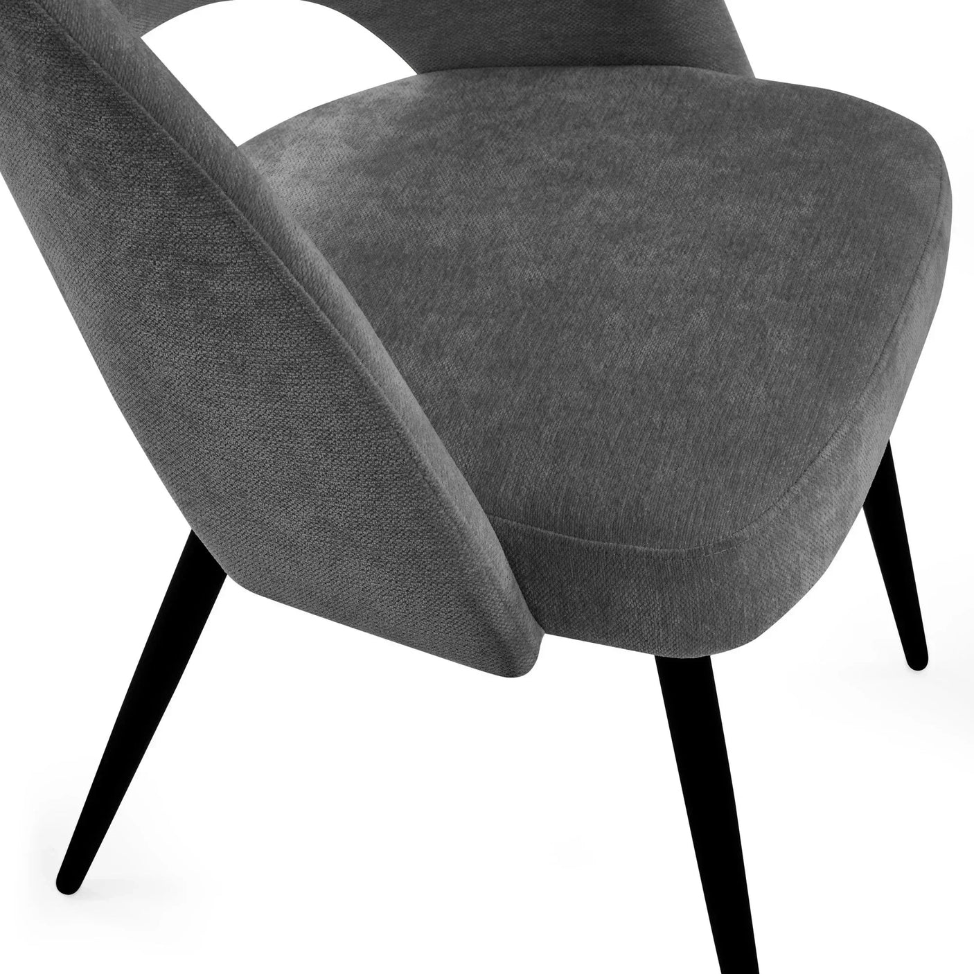 Close-up of modern grey fabric dining chair with angled black legs