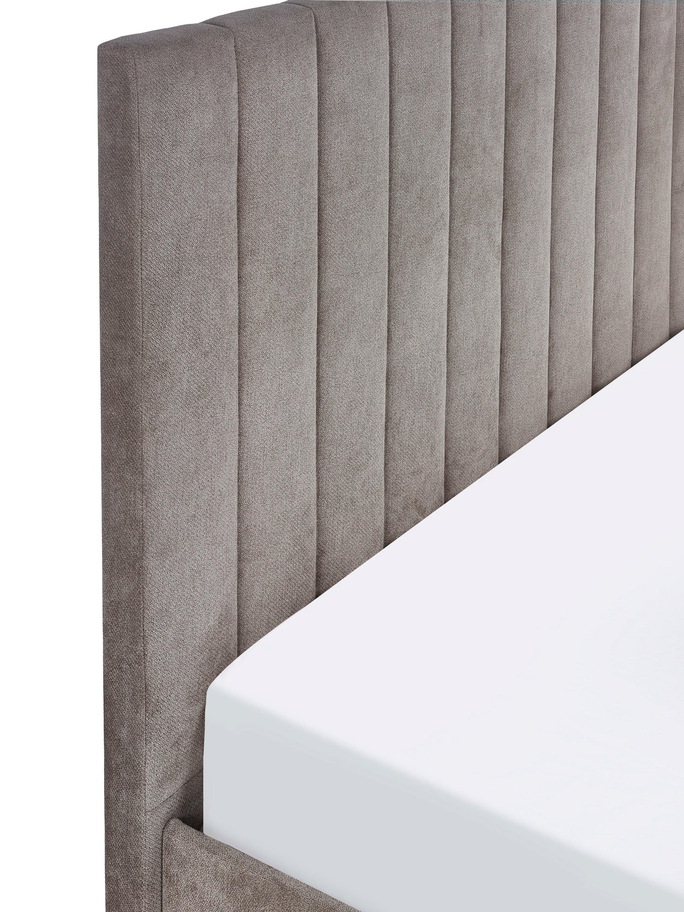 Grey upholstered double bed with vertical panel headboard, close-up view