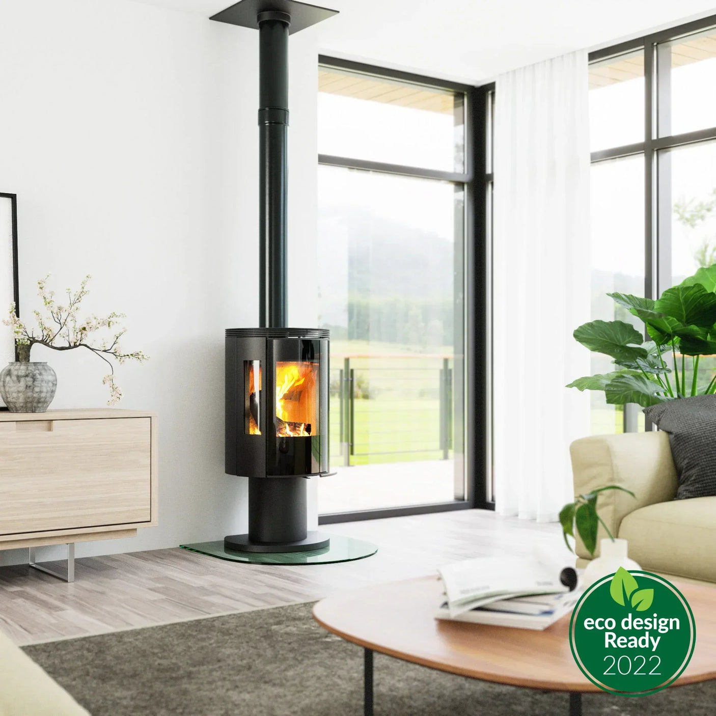 Black modern wood burning stove with glass door in bright living room with large windows