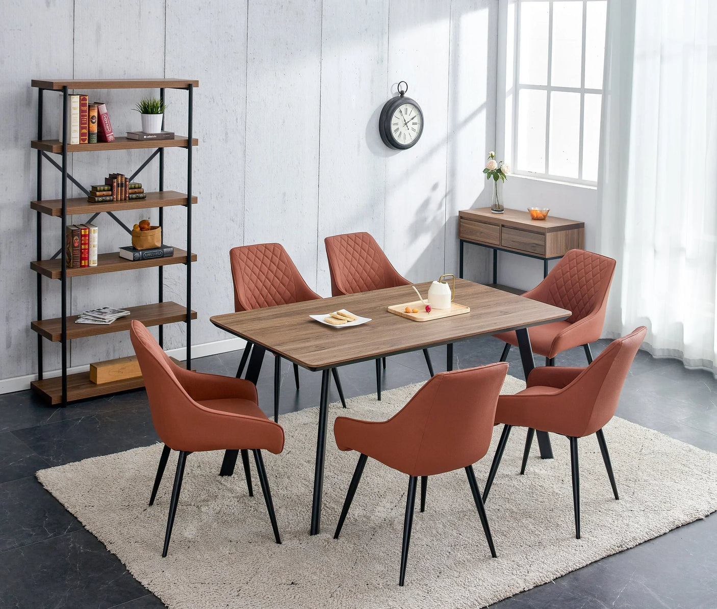 Walnut dining table with six salmon fabric chairs on cream rug in modern dining room