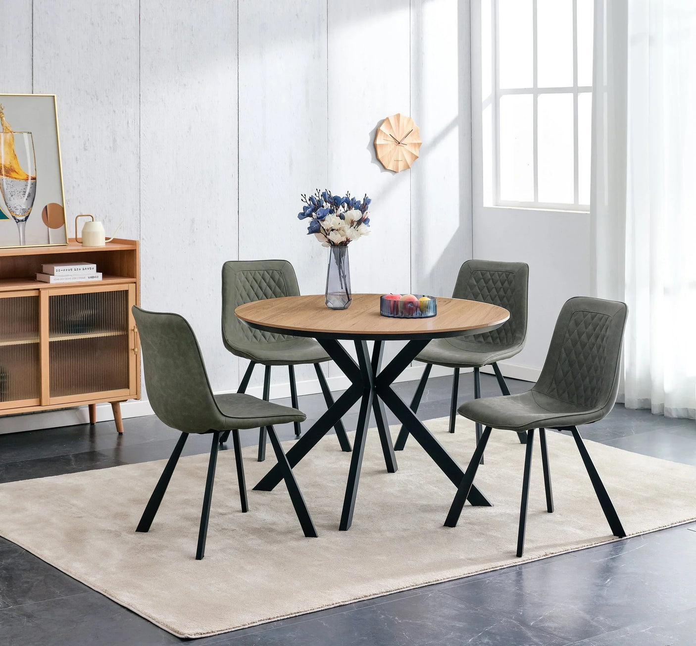 Round oak dining table with black legs and four retro pale oyster chairs in modern room