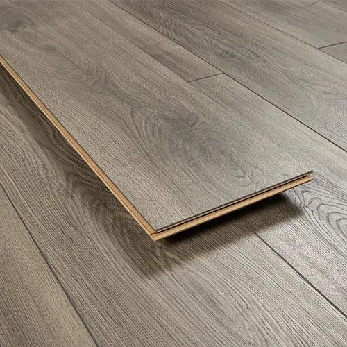 Espresso oak wood flooring plank with textured grain detail, shown on matching floor surface