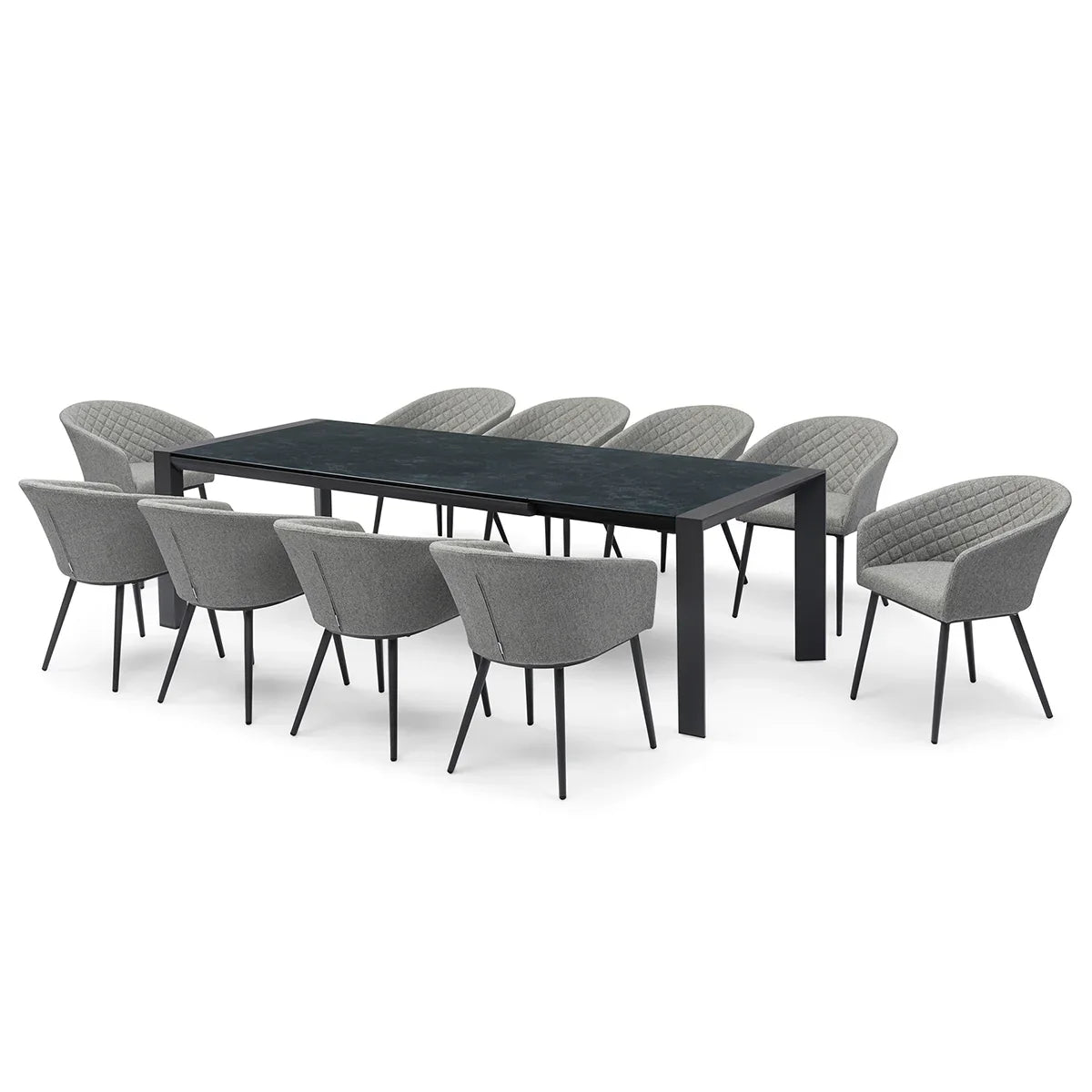 Black dining table with eight grey fabric chairs, quilted backs, and slim black legs