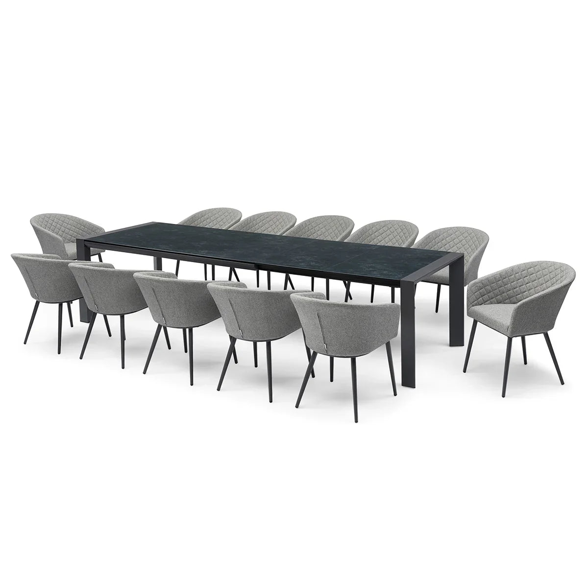 Large black dining table with twelve modern grey upholstered dining chairs arranged around it