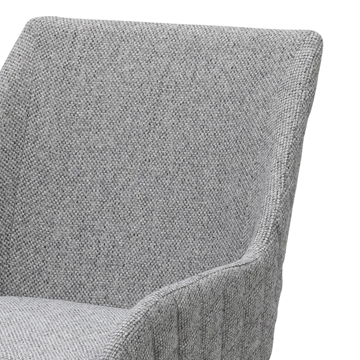 Closeup of grey fabric armchair with textured upholstery and angled backrest