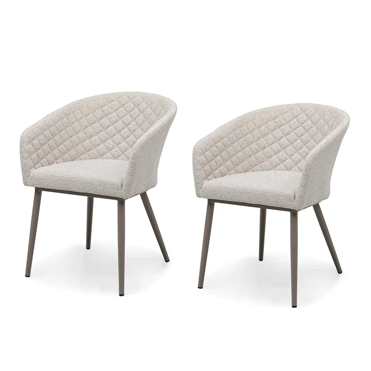 Pair of beige fabric dining chairs with quilted backs and metal legs on white background