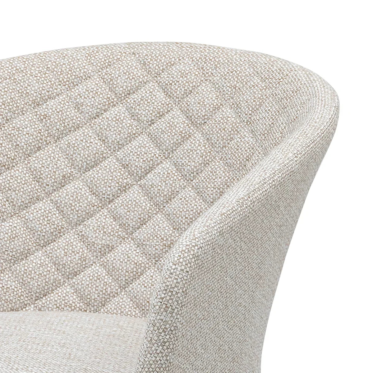 Beige fabric dining chair with quilted backrest and curved arm detail