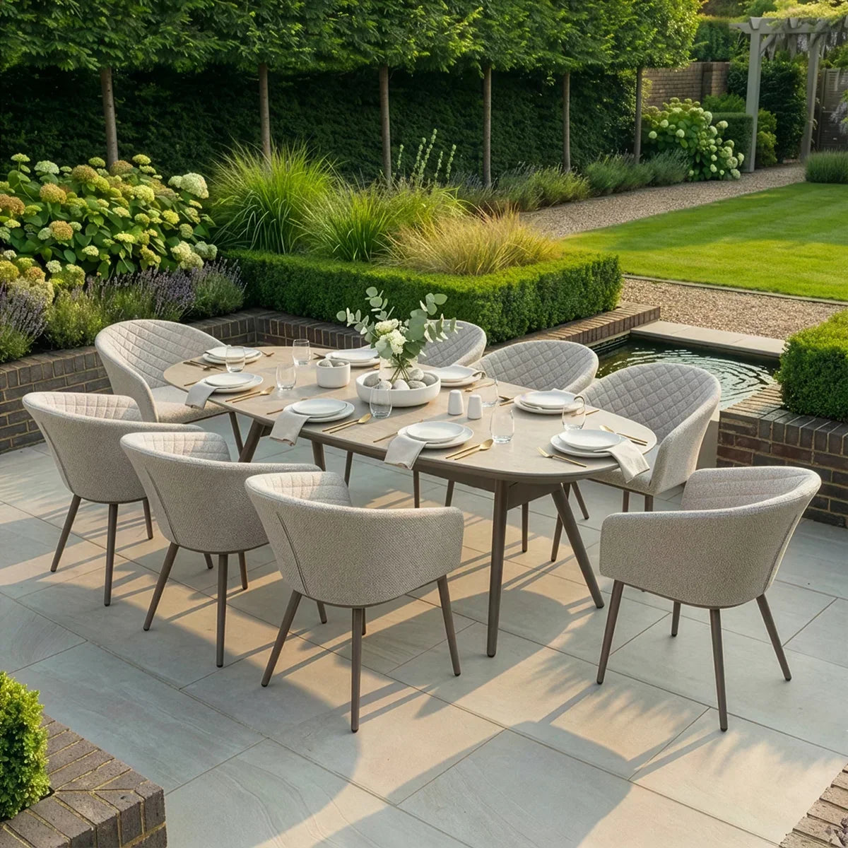 Eight seater garden dining set with cushioned chairs and rectangular table on patio